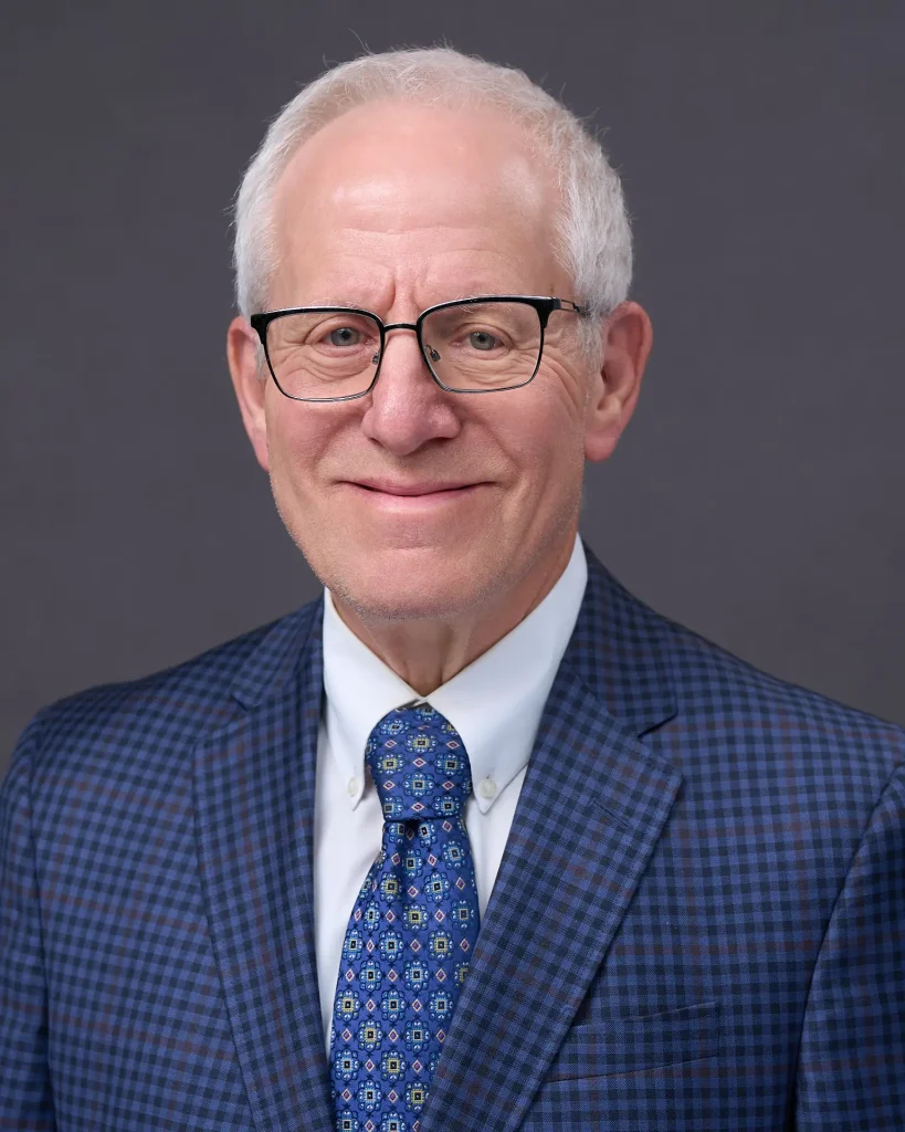 Professional onsite corporate headshot on a studio background